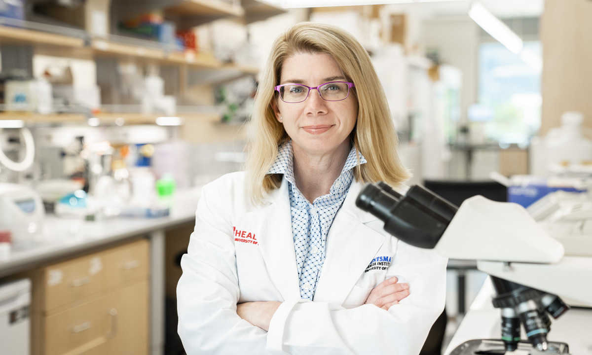 Dr. Allie Grossman stands in a laboratory.