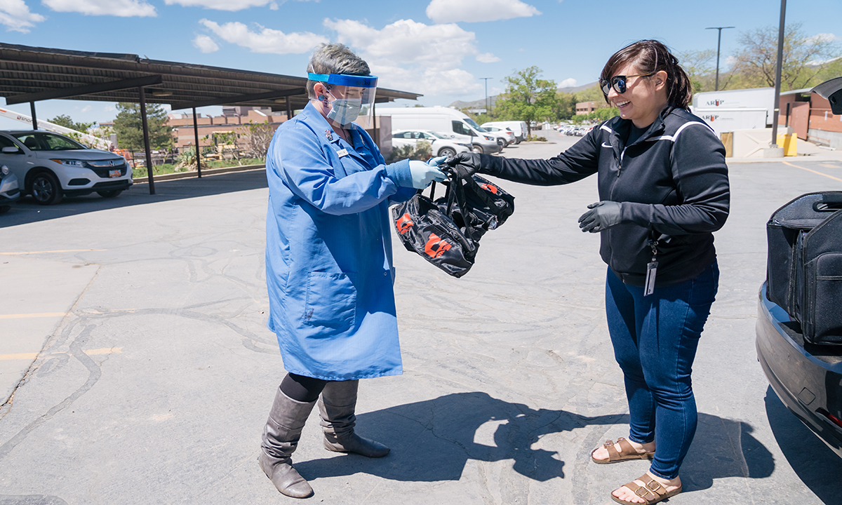 Sara Halford, an employee in ARUP’s Clinical Trials group, receives specimens for testing