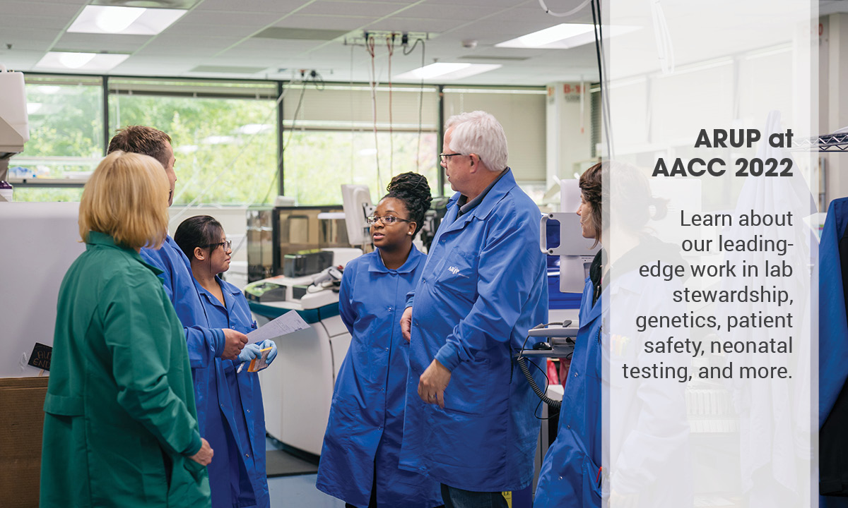 A group of people stand in a lab