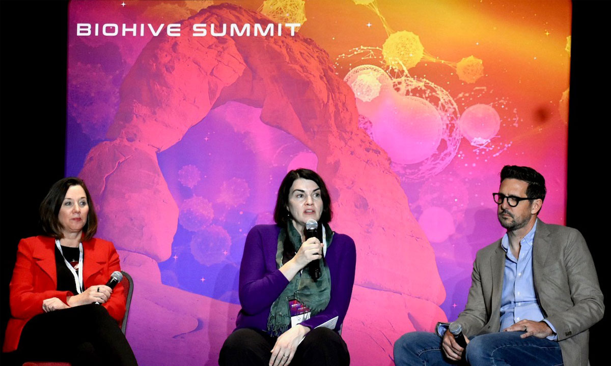 Photo of Kate Benedict, right, Tracy George, and Jared Bauer at the 2022 BioHive Summit