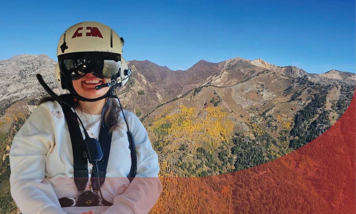 Malinda Burrell wears a helmet and harness. Mountains with fall foliage are in the background.