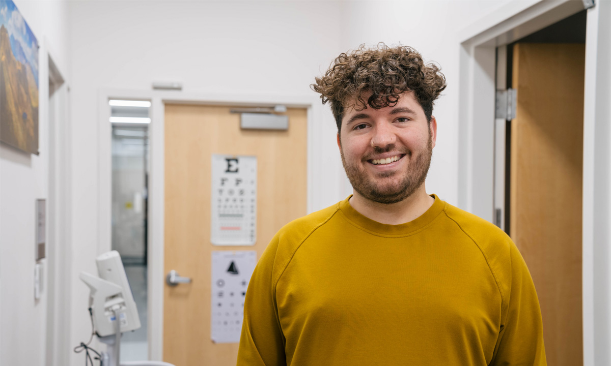 Brysen Bocchino stands in an examination room