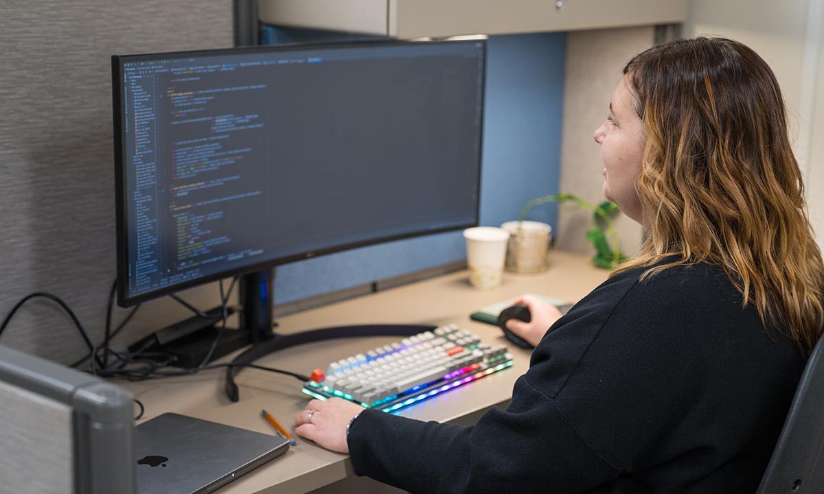 Melanie Mallory works at a computer.