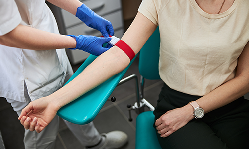person prepares to take a blood sample
