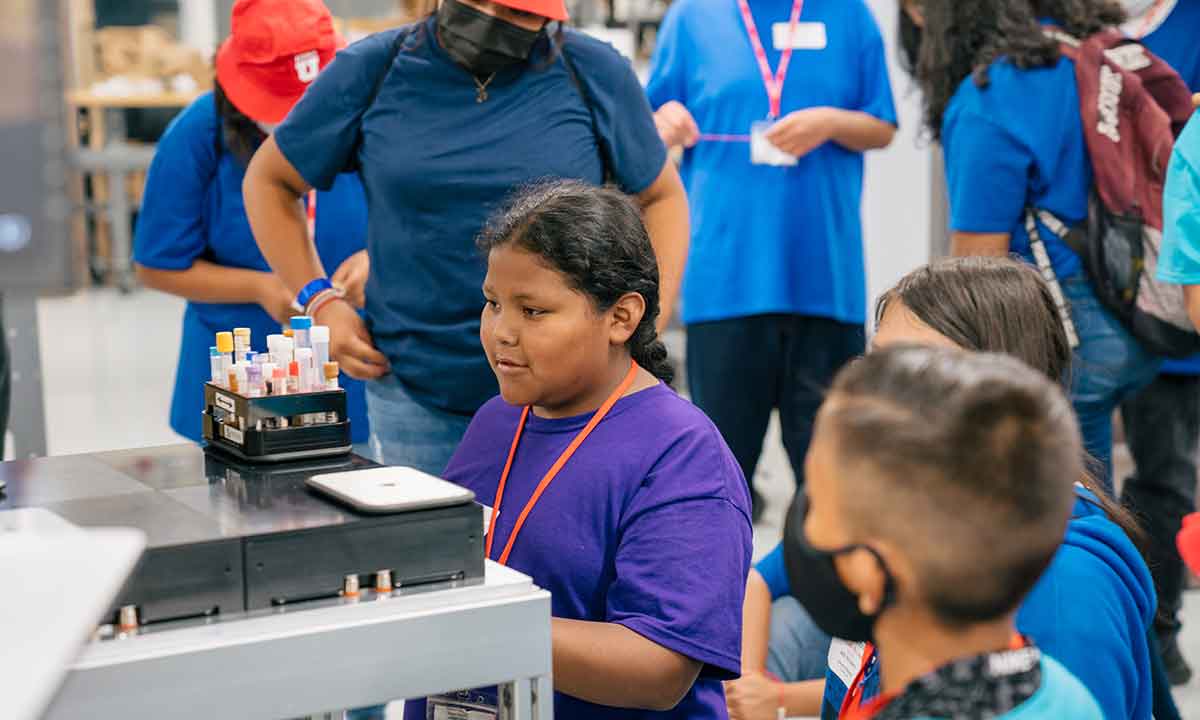 Students in a lab learn how electricity and magnets work together to levitate samples