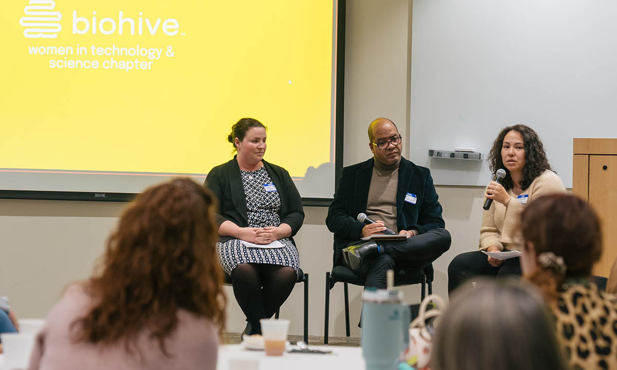 Claire Adam, Jimmy McDonough, and Michaela Hatch speak during a networking event.