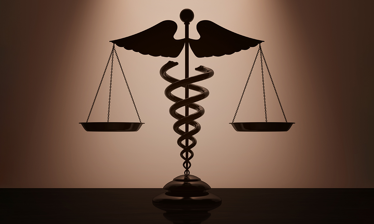 A caduceus balancing scales