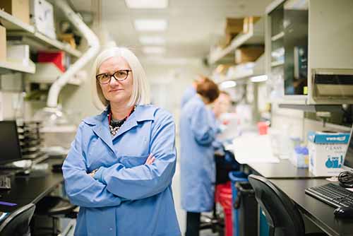 Marzia Pasquali stands in a lab.