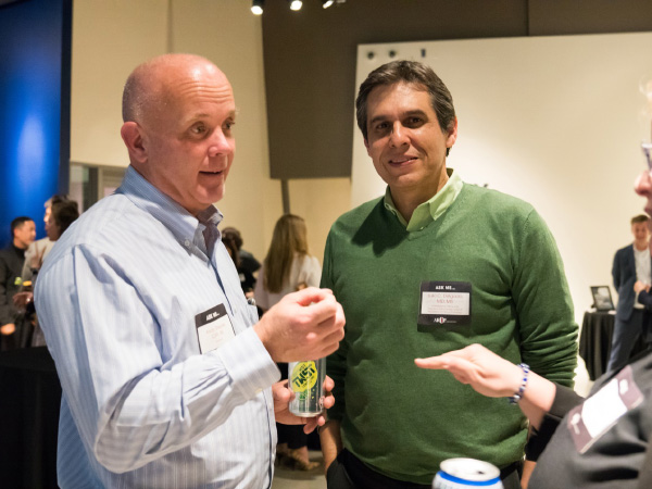 Andy Theurer (left), ARUP’s president, and Julio Delgado, MD, the ARUP’s chief medical officer, visit with colleagues and guests.