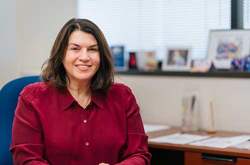 Tracy George, MD, seated in her office