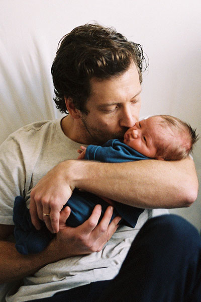 Stew Tribe with his newborn son, Woodward