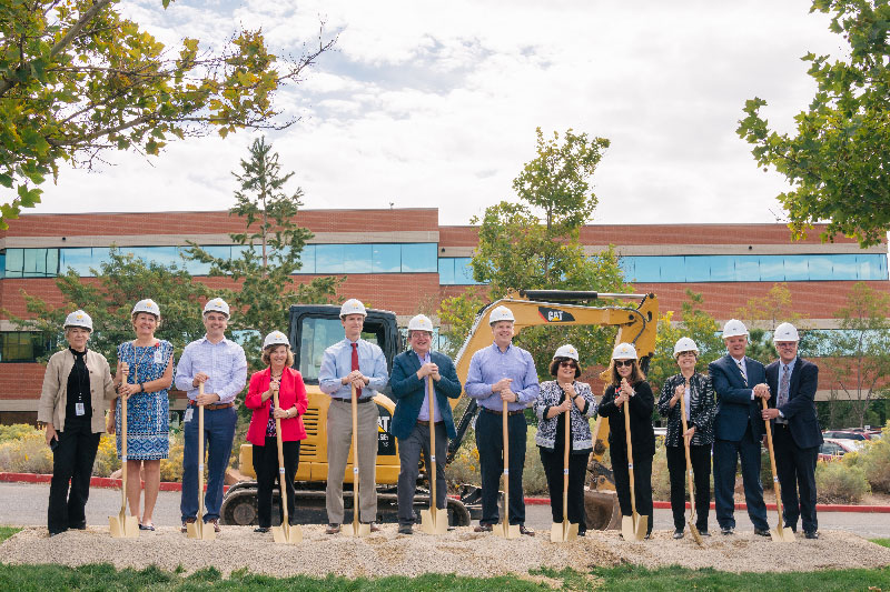 ARUP executives lined up with hard hats and shovels