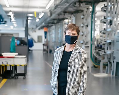 Sherrie Perkins wears a face mask in the lab