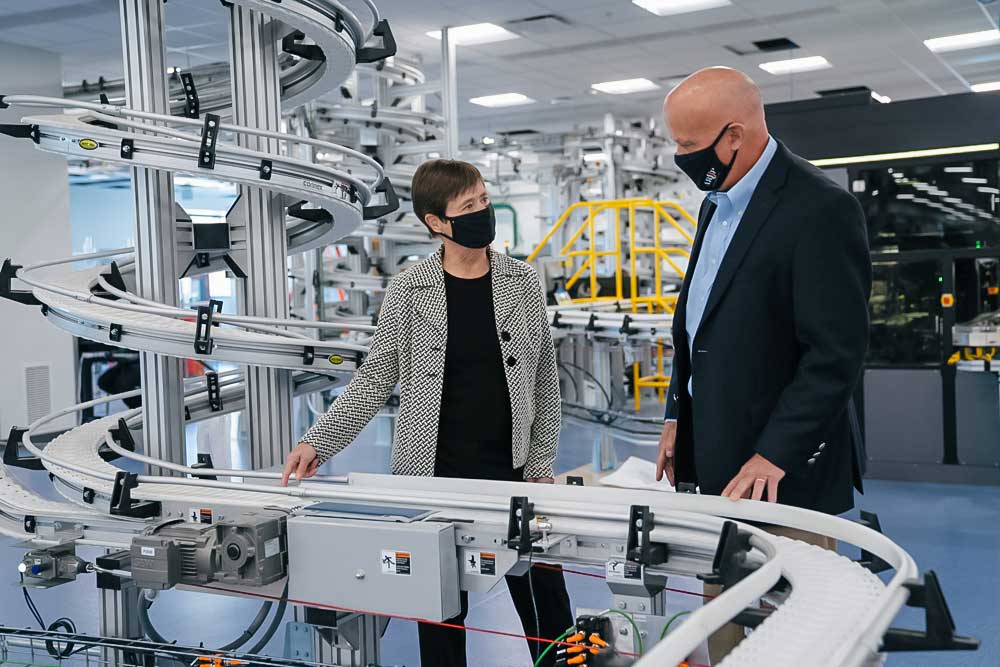  Sherrie L. Perkins and Andy Theurer talking in the lab