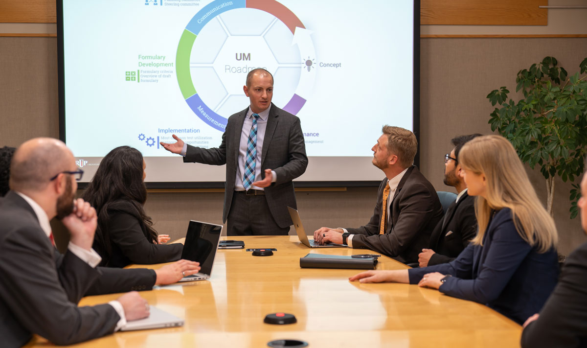 Dave Shiembob leads a meeting in a conference room