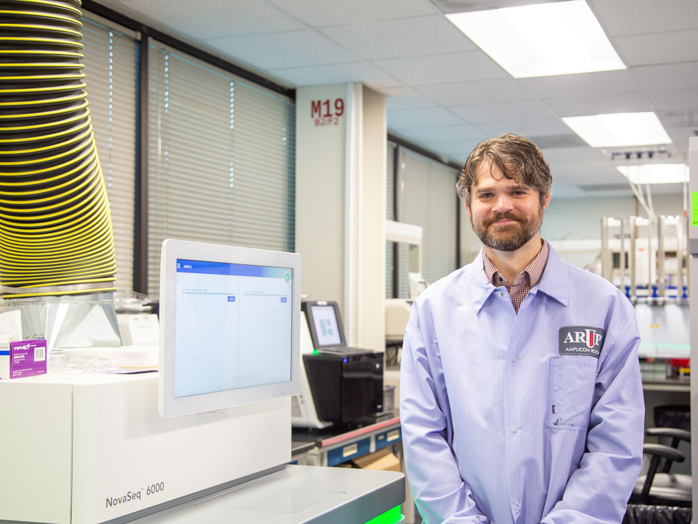Hunter Best stands in the ARUP sequencing lab