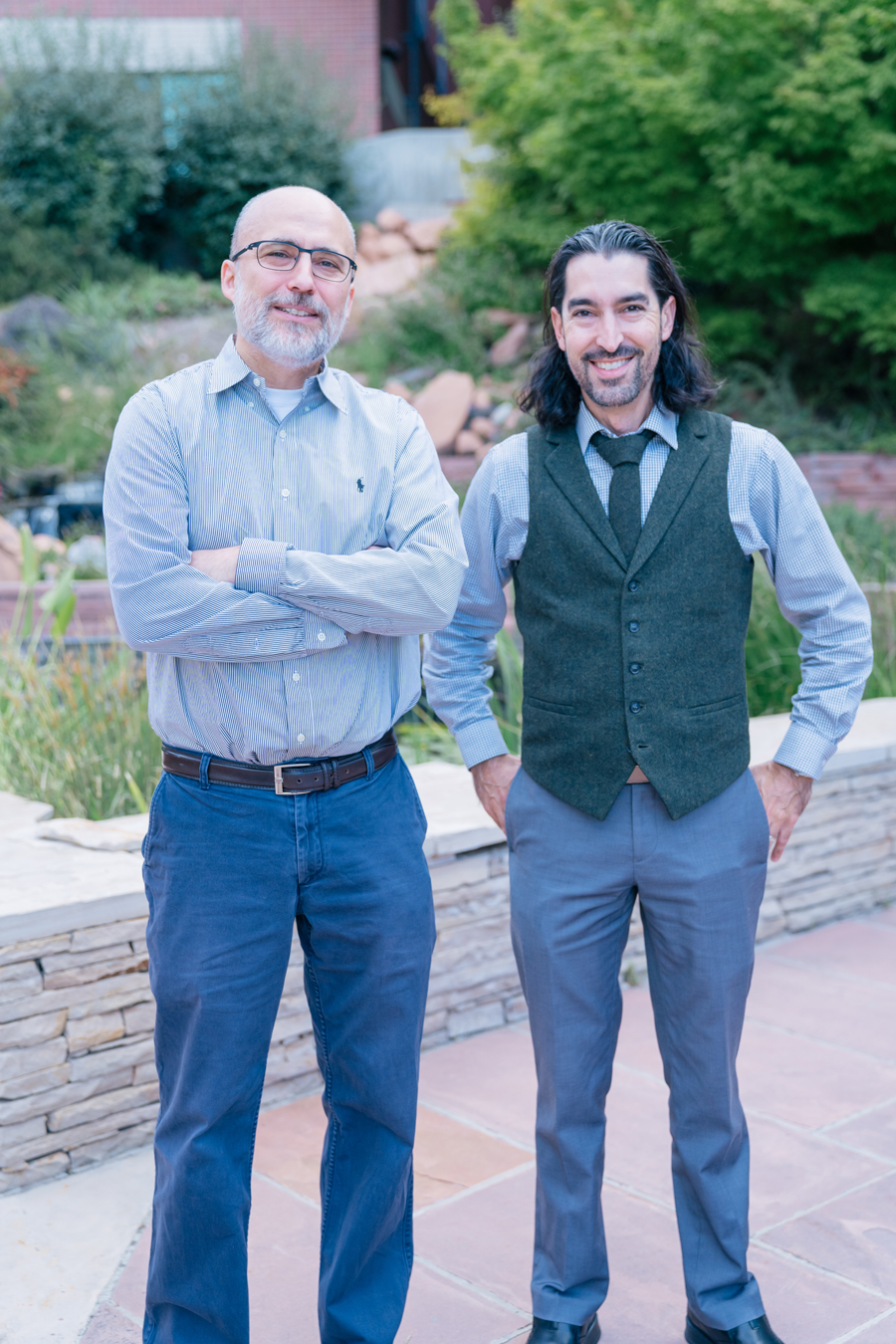 Two men stand together outside