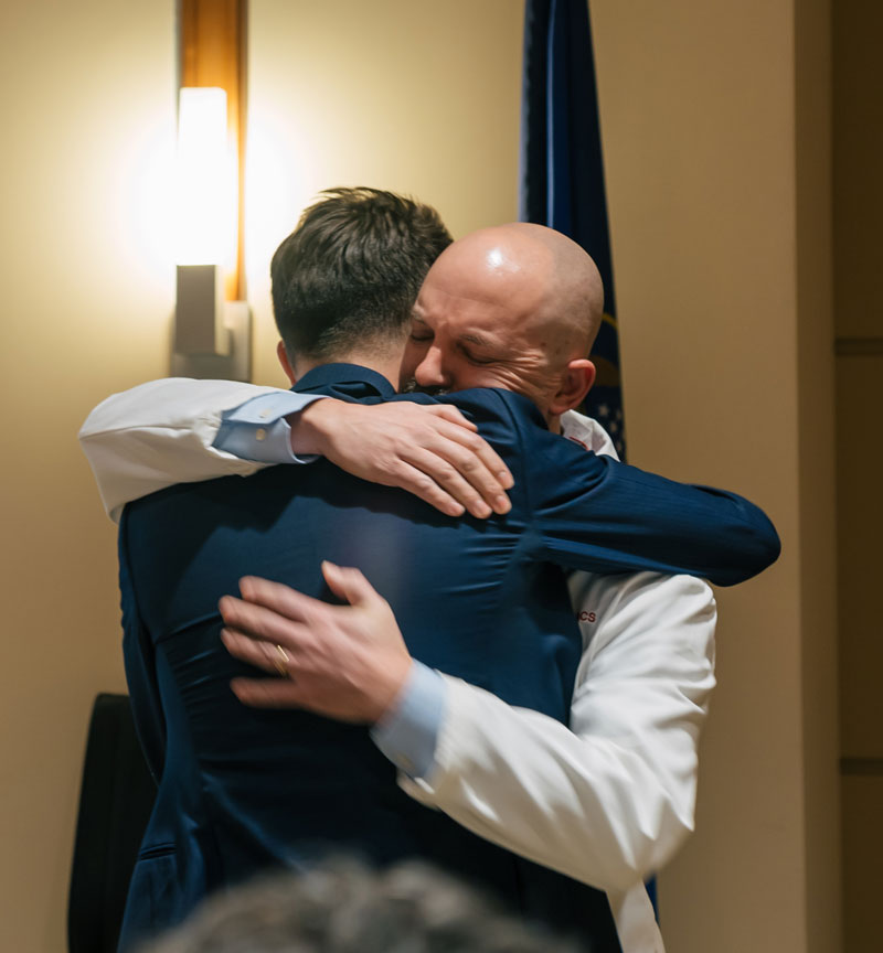 Borges embraces University of Utah Hospital Trauma Medical Director Toby Enniss