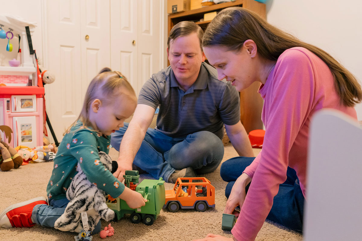 The Jones family in a room with toys