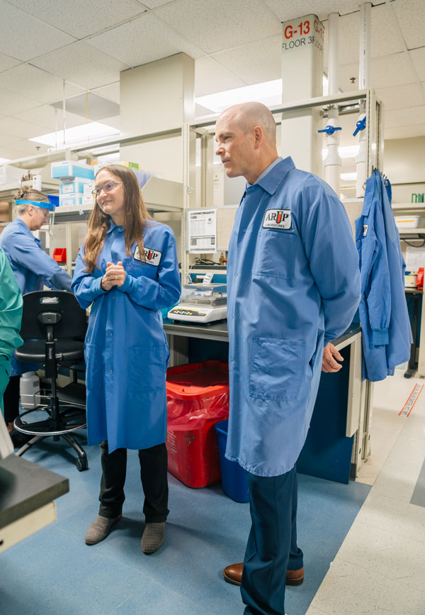 Two people in lab coats