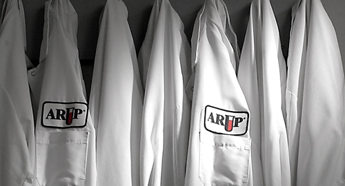 A row of hanging labcoats