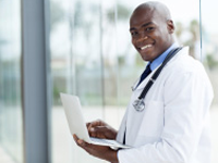 Doctor holding a laptop.