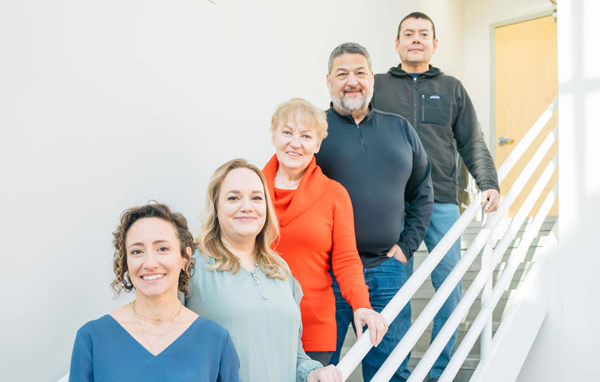 A group of technologists on a staircase